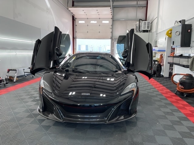 Black McLaren in ATD detailing bay